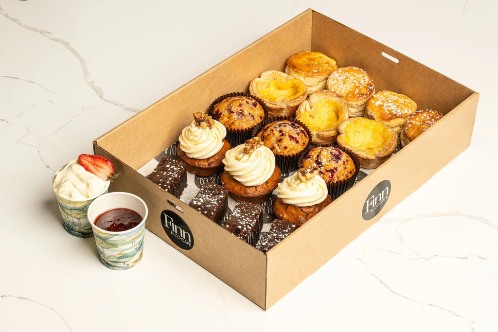 Assorted cake platter with house-made cakes, muffins and chocolate brownie for corporate catering, office meetings, celebrations and events. Delivery in Sydney and the Blue Mountains